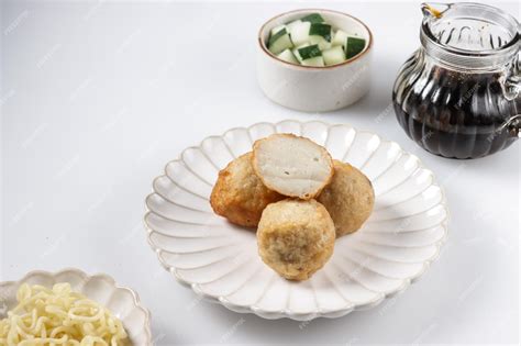 Premium Photo | Pempek adaan or pempek bulat is round shape of fish cake from palembang, served ...