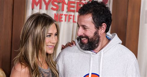 Jennifer Aniston Shines In Sheer Sparkling Silver Mini Dress While Roasting Adam Sandler Wearing