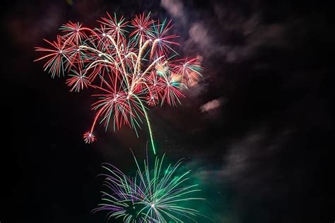 Vibrant Explosion Of Diverse Colored Fireworks Illuminating The Night