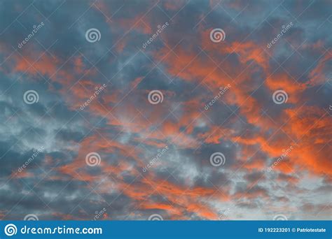 The Sky At Sunset Cumulus Clouds Lit By The Rays Of The Setting Sun