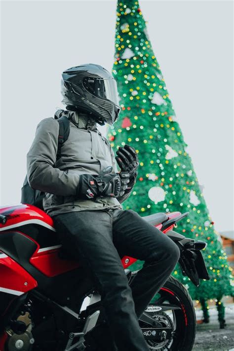 Photo of a Biker and a Christmas Tree · Free Stock Photo