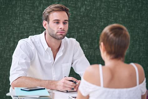 Male Mentor Tutoring His Female Student in Local Coffee Shop Stock ...