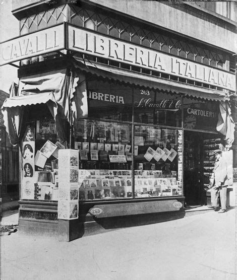 An Old Black And White Photo Of A Store Front