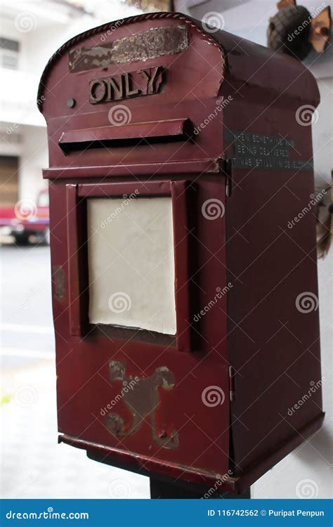 Mailbox is red iron old. stock photo. Image of office - 116742562