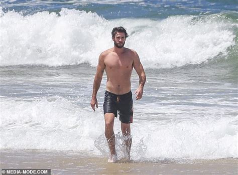 Shirtless Liam Hemsworth Packs On PDA With Bikini Clad Girlfriend Gabriella Brooks On Byron