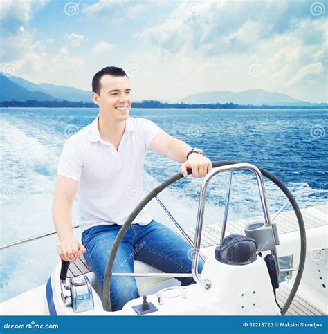 A Handsome Man Sailing In The Sea Stock Photo Image Of Nautical