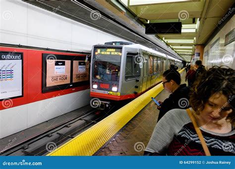 Muni Subway Train Arriving At Castro Station While Commuters Waiting