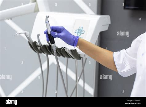 Dental Assistant Holding Dental Equipment Stock Photo Alamy