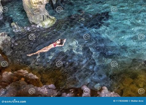 Hispanic Brunette Model Enjoying A Swim In A Cenote Stock Photo Image