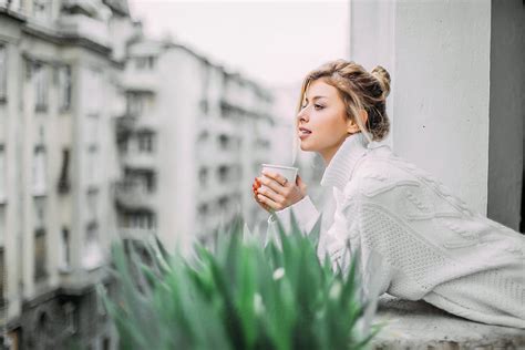 Woman Enjoying In A Cup Of Tea On The Balcony Del Colaborador De