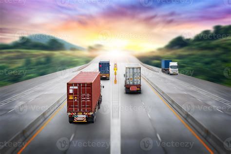 Truck Transport With Red Container On Highway Road At Sunset Motion