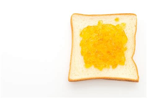 Premium Photo Slices Of Bread With Orange Jam