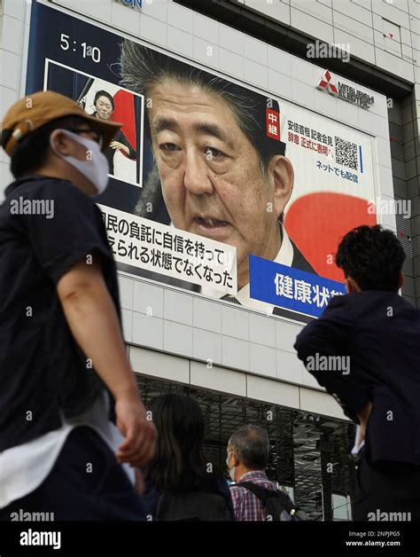 A Monitor Shows The Press Conference Of Japans Prime Minister Shinzo