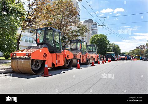 Among The Summer Noon Three Heavy Road Vibrating Roller Compactors And