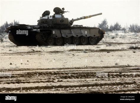 A damaged Iraqi T-72 main battle tank sits in the desert after being ...