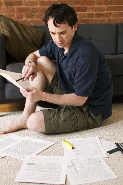 Man On Floor Paying Bills Free Photo Download Freeimages