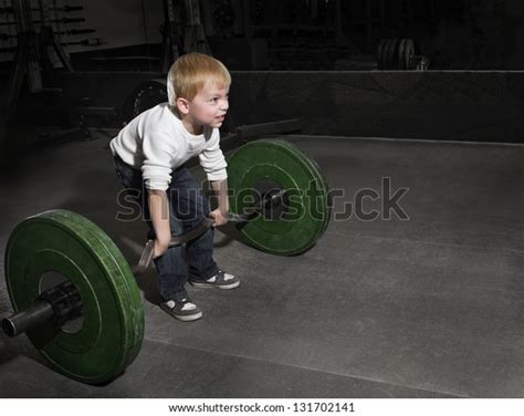 Determined Young Boy Trying Lift Heavy Stock Photo Edit Now 131702141