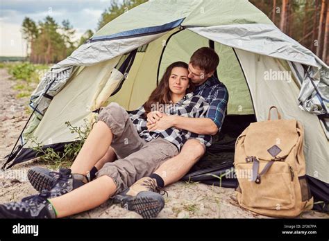 Romantic Couple Camping Outdoors And Sitting In A Tent Happy Man And Woman On A Romantic