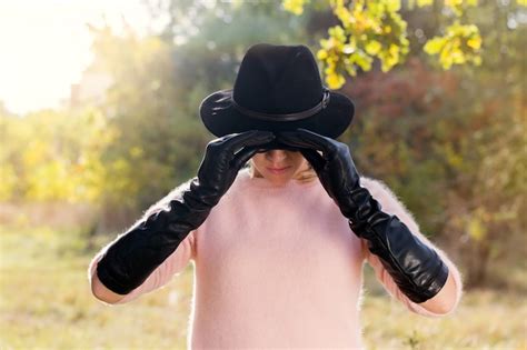 Premium Photo Woman Holding Hat