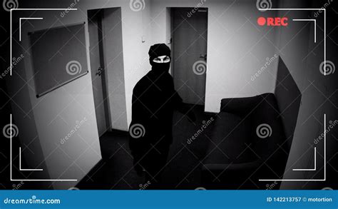Robber In Mask Looking Surveillance Camera Corporative Building