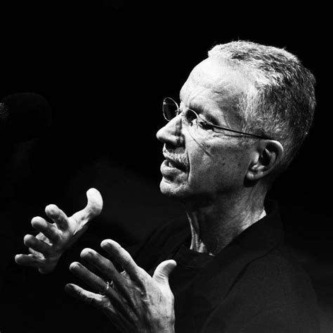 a black and white photo of a man speaking