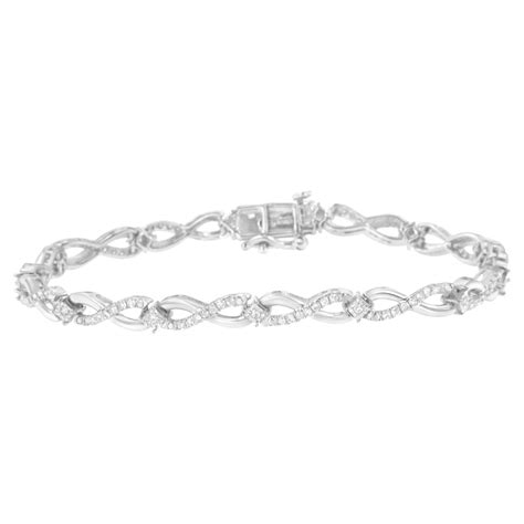 Sterling Silver Prong Set Diamond Accent Ribbon And Infinity Link