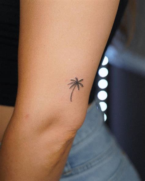 Fine Line Style Palm Tree Tattoo Placed On The Upper