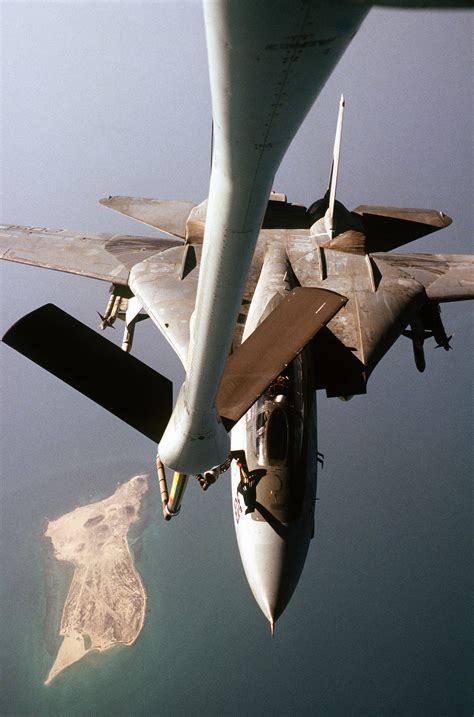 A Fighter Squadron 21 VF 21 F 14A Tomcat Aircraft Is Refueled By An