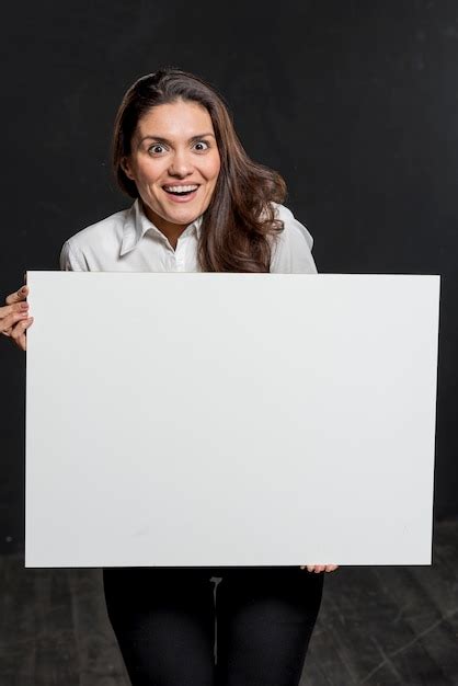 Free Photo Young Woman Holding Blank Paper Sheet
