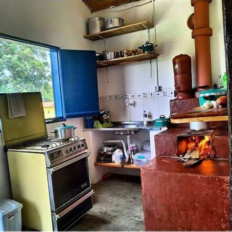 A Stove Top Oven Sitting Inside Of A Kitchen Next To A Refrigerator