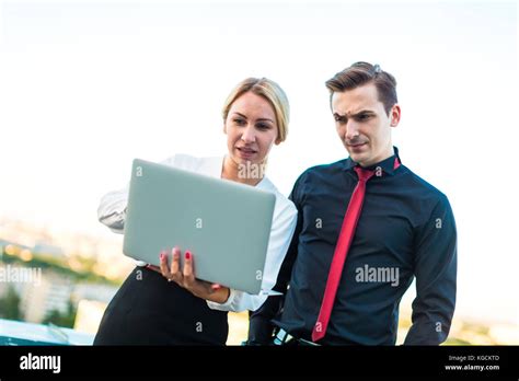 Couple Of Businessmen Serious Brunette Man And Attractive Blond Stock
