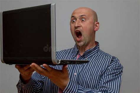 Shocked Surprised Man Looking At Laptop Computer Surprised And Amazed