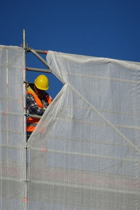 Construction Worker At Work On A Building In Renovation On A