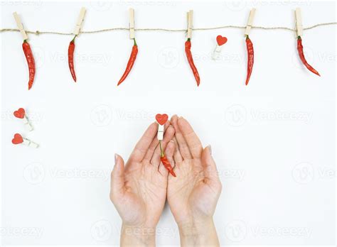 Womens Hands Hold A Red Hot Pepper In Her Hand As A Symbol Of Love Stock Photo At Vecteezy