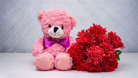 Premium AI Image | A pink teddy bear with a bouquet of red flowers