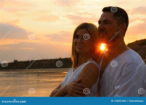 Happy Romantic Couple Spending Time Together On Beach At Sunset Stock