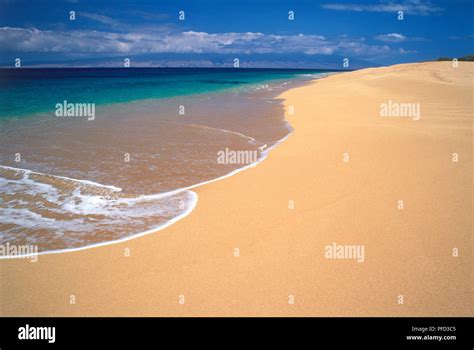 USA, Hawaii Islands, Lana'i, Polihua Beach, water lapping onto beach of ...