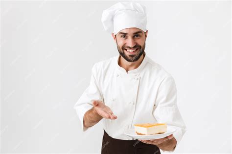 Premium Photo Joyful Chief Man In Cook Uniform Smiling And Holding