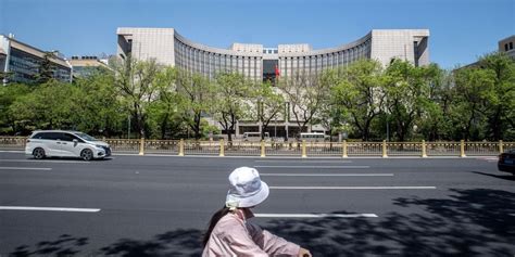 Chinas Central Bank Cuts Key Policy Rate Wsj