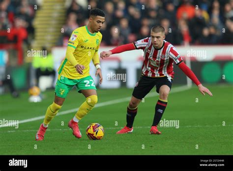 Lewis Dobbin Of Norwich City Is Pressured By Alfie Gilchrist Of