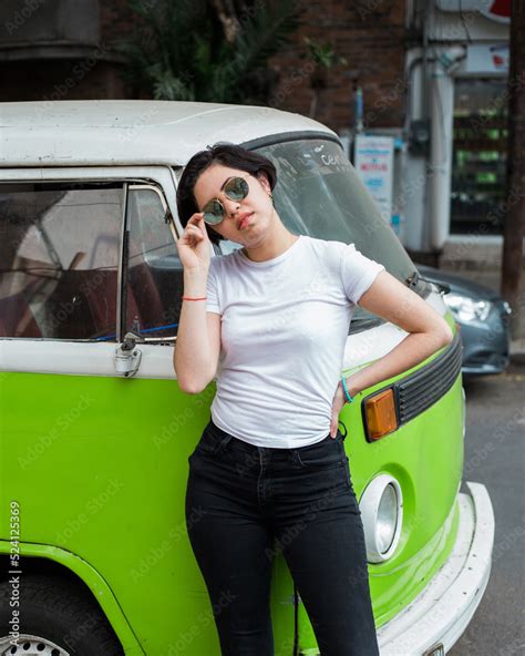 Young Greaser Girl With Short Hair Posing With A Fifties Rockabilly