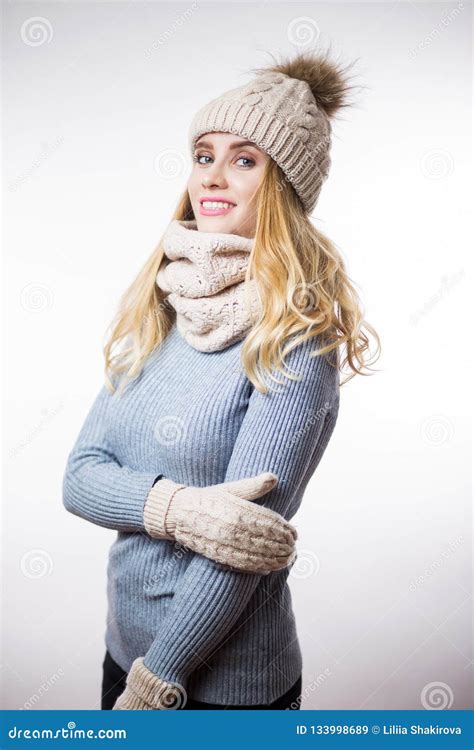 Portrait Of Beautiful Young Blonde Woman Wearing Warm Knitted Sweater