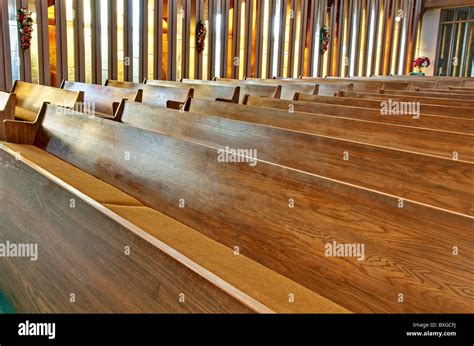 This Stock Image Has Rows Of Empty Wooden Church Pews With Sunlight