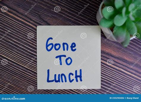 Gone To Lunch Write On Sticky Notes Isolated On Wooden Table Stock