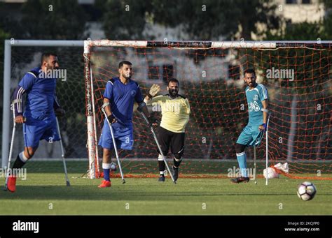 Palestinian amputee soccer players take part in a league match for ...