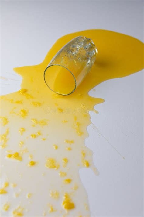 Fresh Orange Juice Spilled On A White Table Stock Image Image Of