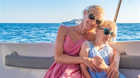 Adult Son Hugs Elderly Mother People Look Out The Window Stock Image