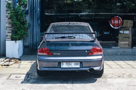 Grey Mitsubishi Lancer Evolution Vii Gt A Ct A On Car Workshop Parking