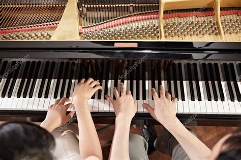 Piano duet Stock Photo by ©OtnaYdur 24527415
