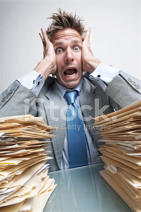 Stressed Businessman Office Worker Is Overwhelmed With Paperwork Stock